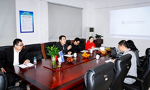 SCICOOLING representatives meeting with the Qingqing Butler delegation in a conference room for business discussions.