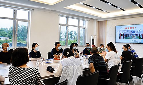 Huairou District Education Commission representatives attending a meeting with SCICOOLING staff