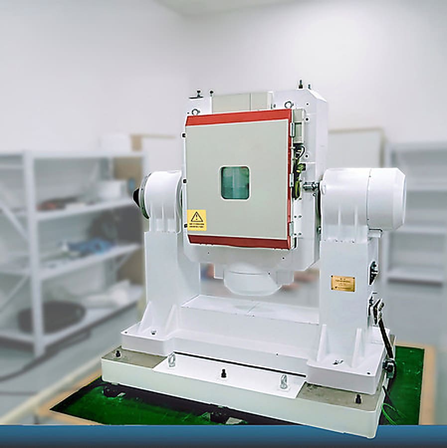 Compact rotary temperature chamber on a white test platform