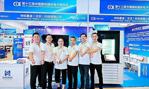 SCICOOLING team posing together at the defense electronics exhibition booth