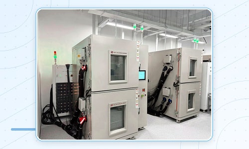 Environmental chambers connected to battery cycling cables and test racks