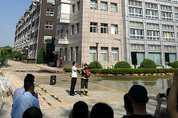 SCICOOLING fire safety training activity with firefighters providing emergency knowledge instruction