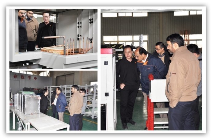 Pakistani clients visiting SCICOOLING’s production workshop and observing equipment manufacturing processes with company staff.