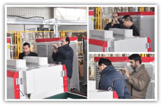  Pakistani experts inspecting SCICOOLING equipment in the production workshop with company representatives.
