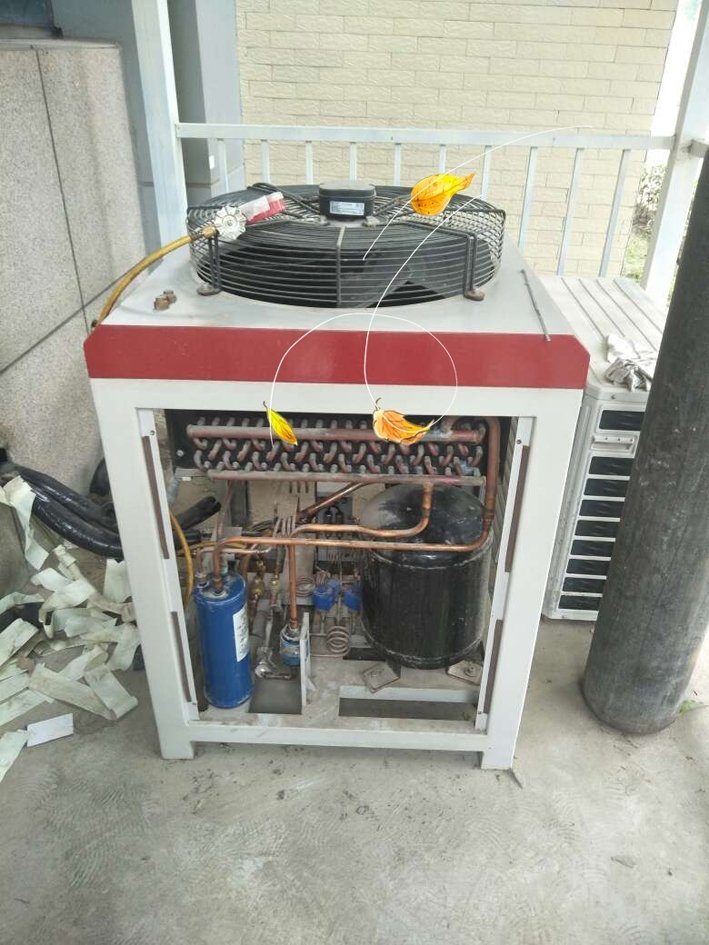 Outdoor equipment unit with exposed internal components showing dust and signs of poor maintenance.