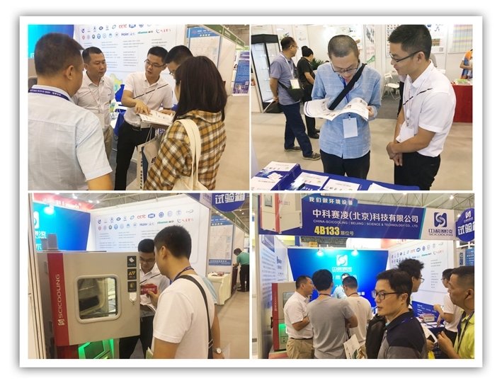 Visitors discussing SCICOOLING environmental testing equipment at an exhibition booth.
