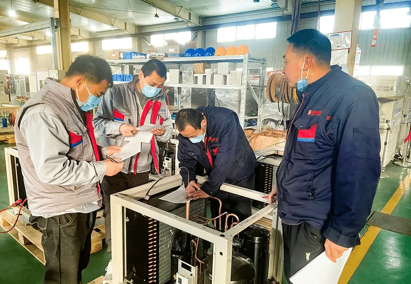 SCICOOLING engineers performing equipment assembly inspection and technical debugging