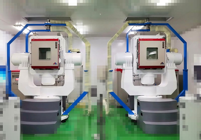 Two rotary-table temperature chamber systems in an aerospace laboratory