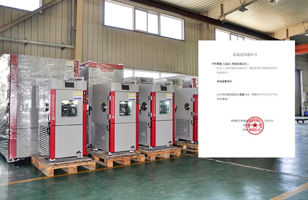 SCI chambers on pallets beside a customer acceptance letter