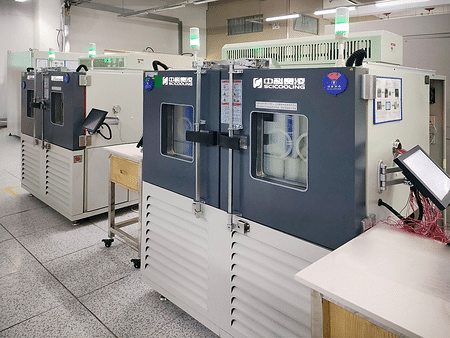 Environmental chambers arranged in an automotive test laboratory