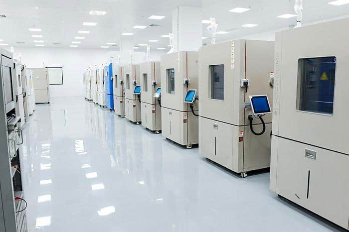 Rows of environmental chambers in an intelligent third-party test laboratory