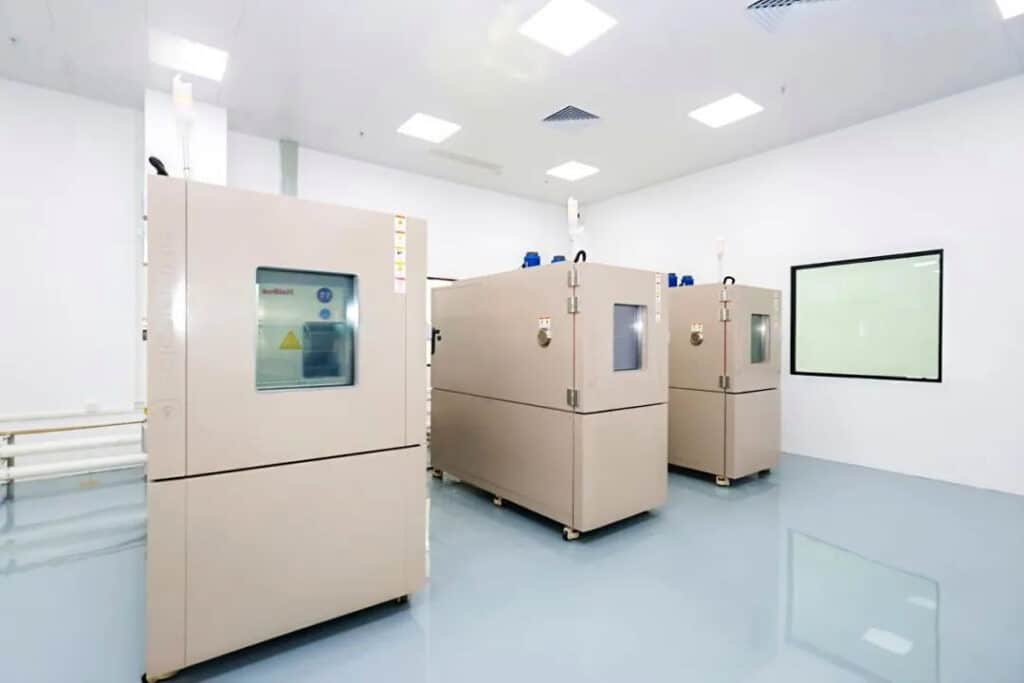 Three environmental chambers arranged in a bright laboratory