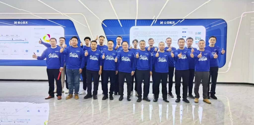 SCICOOLING sales team holding a conference banner