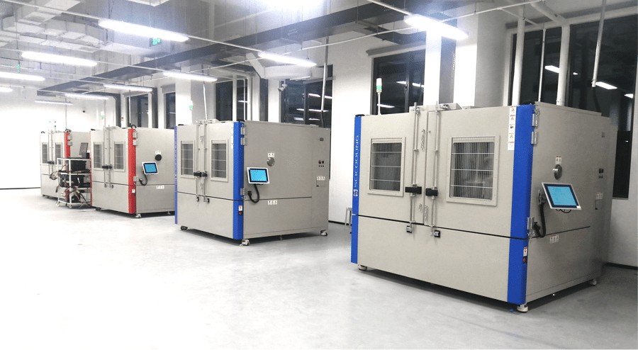 Rows of large environmental chambers in a lithium battery test laboratory
